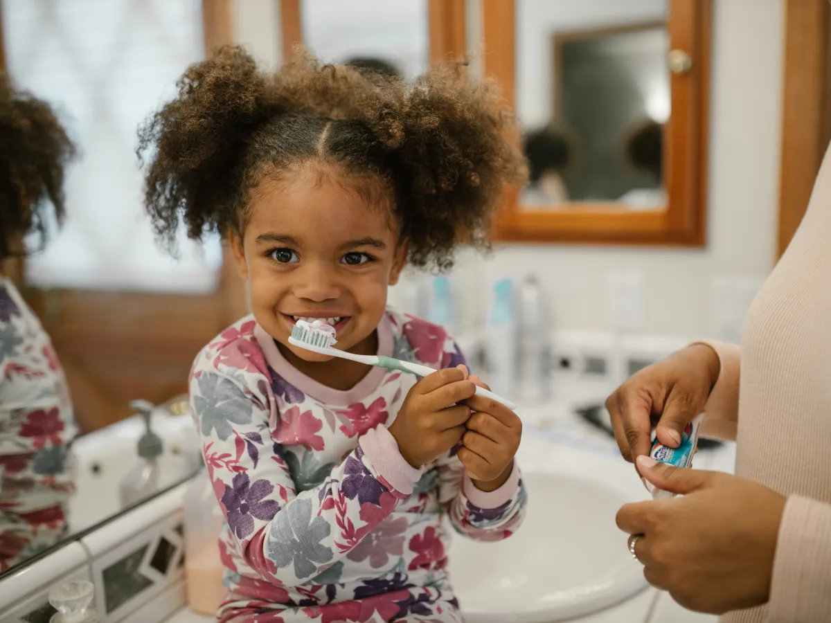 girl with toothbrush