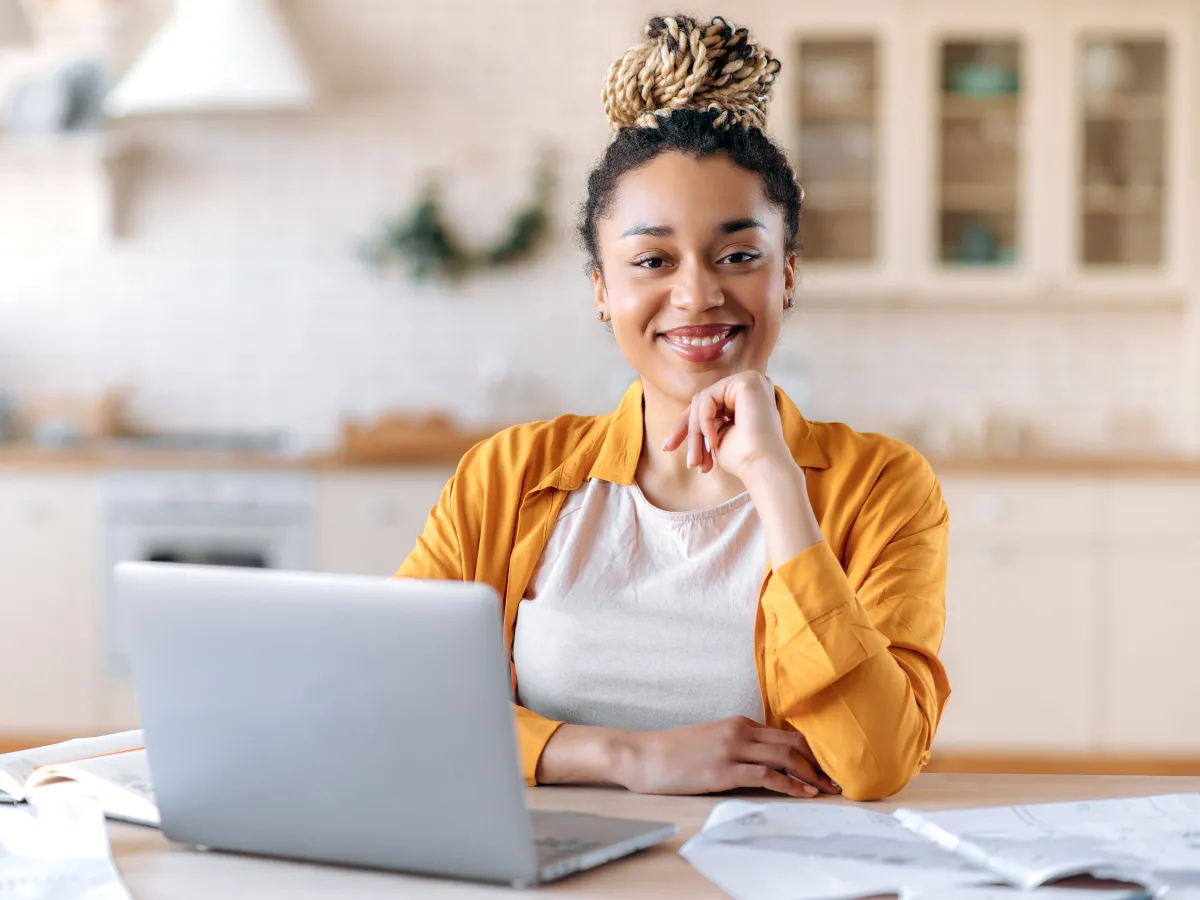 woman smiling on laptop
