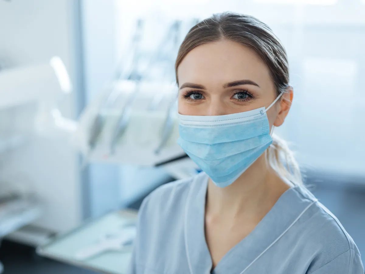 female dentist wearing mask