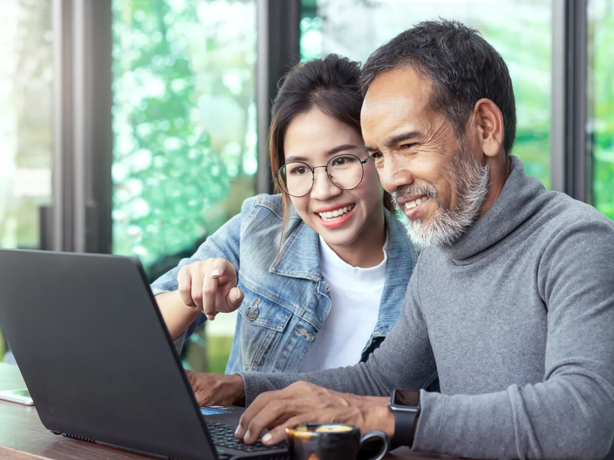 people smiling at computer