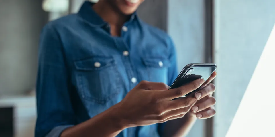 woman smiling on phone