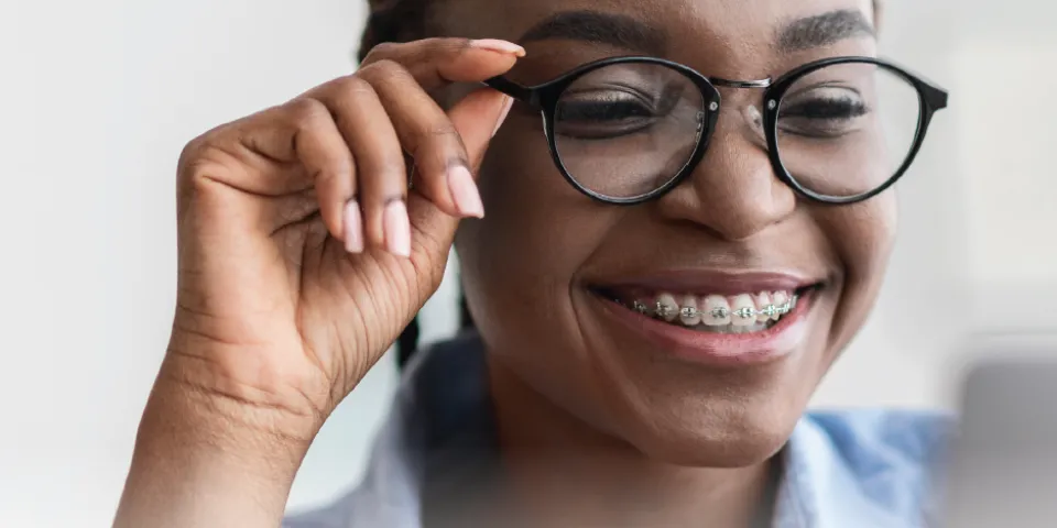 woman smiling with glasses