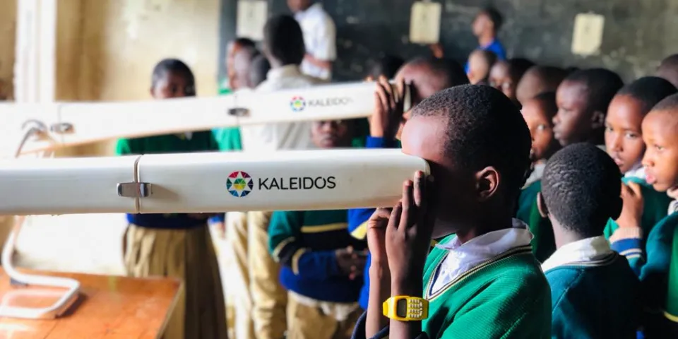 African boy getting eye exam